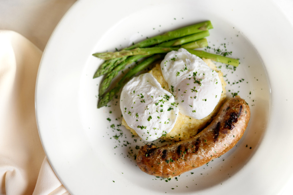 Juban’s Boudin and Garlic Goat Cheese Grits with poached eggs  