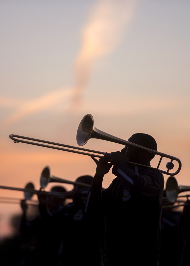 Pastel colors fill the sky as the sun rises above the Human Jukebox as they finish up their first practice of the day.