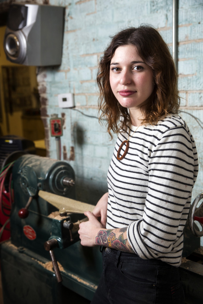 Beneath the Bark designer Molly Taylor handcrafts many of her wooden jewelry pieces on this antique lathe in the Mid City woodshop she shares with her boyfriend.