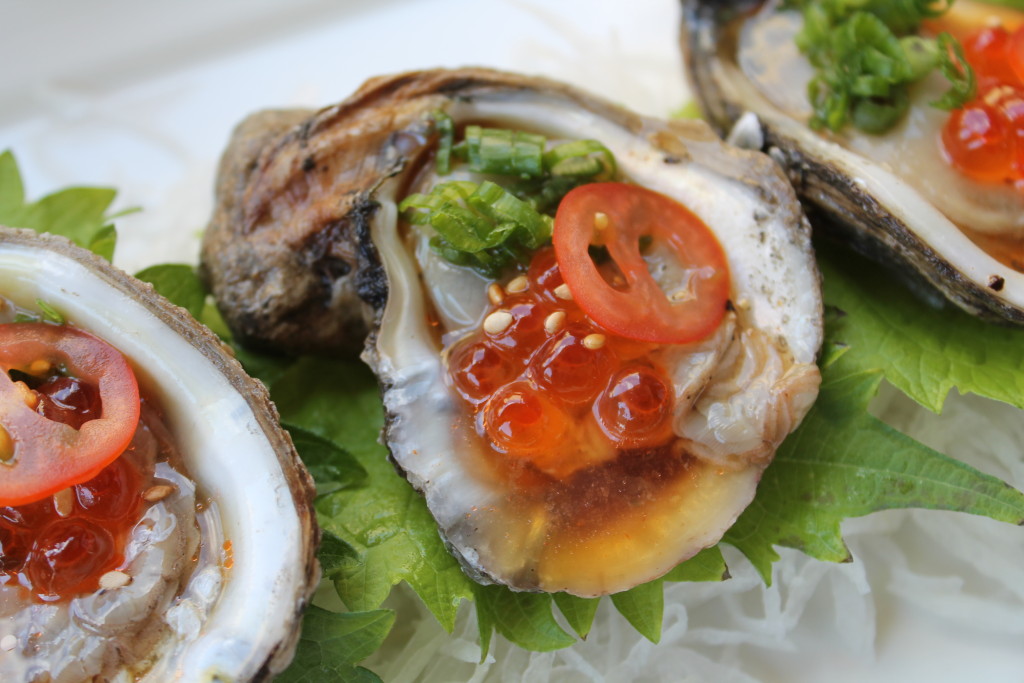 Oyster shooters with Tabasco vinaigrette, masago, scallions and roasted sesame seeds 