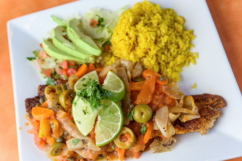 Redfish Veracruz tops the grilled fish with tomato sauce, olives, capers and pickled carrots. 