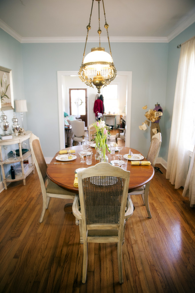 Vintage dining table and chairs were passed down to Andrus by her mom and aunt. She found the light fixture at consignment shop C’est Bon.