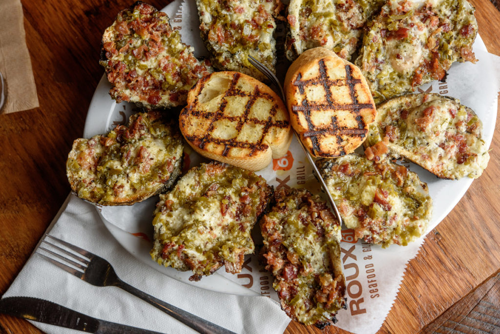 The Oysters Diablo appetizer features chargrilled oysters covered in copious amounts of bacon, jalapeños and Parmesan cheese.