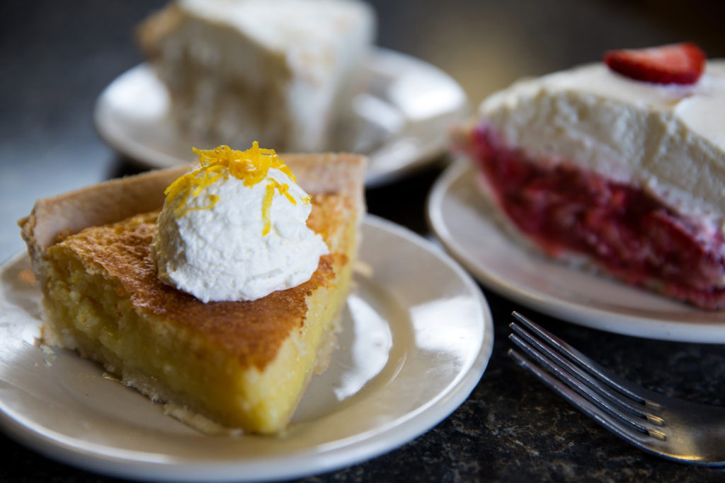225 City Pork & Pie, Collin Richie Photo, 6.28.16 - The Cajun sandwich (ham, andouille and bacon) with kettle chips on the side - Pig Platter served with pickles, Texas toast and pickled red onions - Sides: Green beans, Cajun rice, smoked corn grits and stewed okra. - Dessert: Lemon and Strawberry Pie