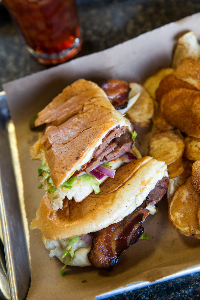 225 City Pork & Pie, Collin Richie Photo, 6.28.16 - The Cajun sandwich (ham, andouille and bacon) with kettle chips on the side - Pig Platter served with pickles, Texas toast and pickled red onions - Sides: Green beans, Cajun rice, smoked corn grits and stewed okra. - Dessert: Lemon and Strawberry Pie