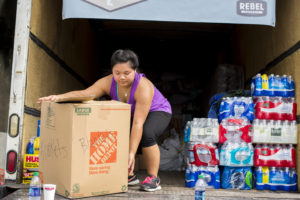 Lynnvi Dang loads a truck of donations at the event.