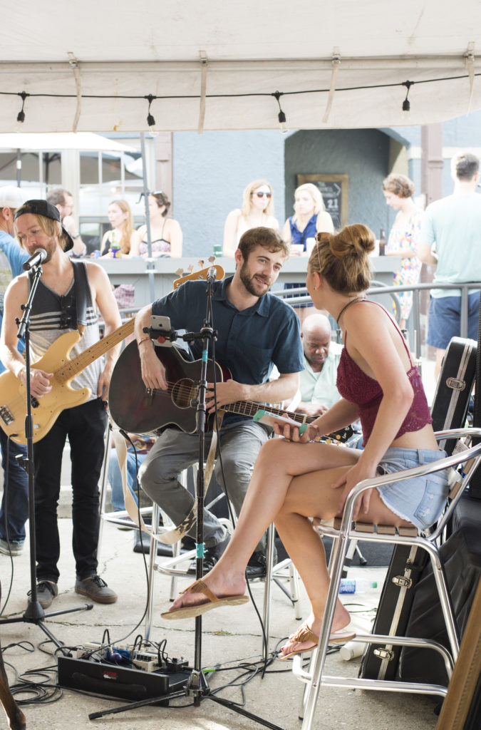 The Zipties perform for the fundraiser outside of the Overpass Merchant.