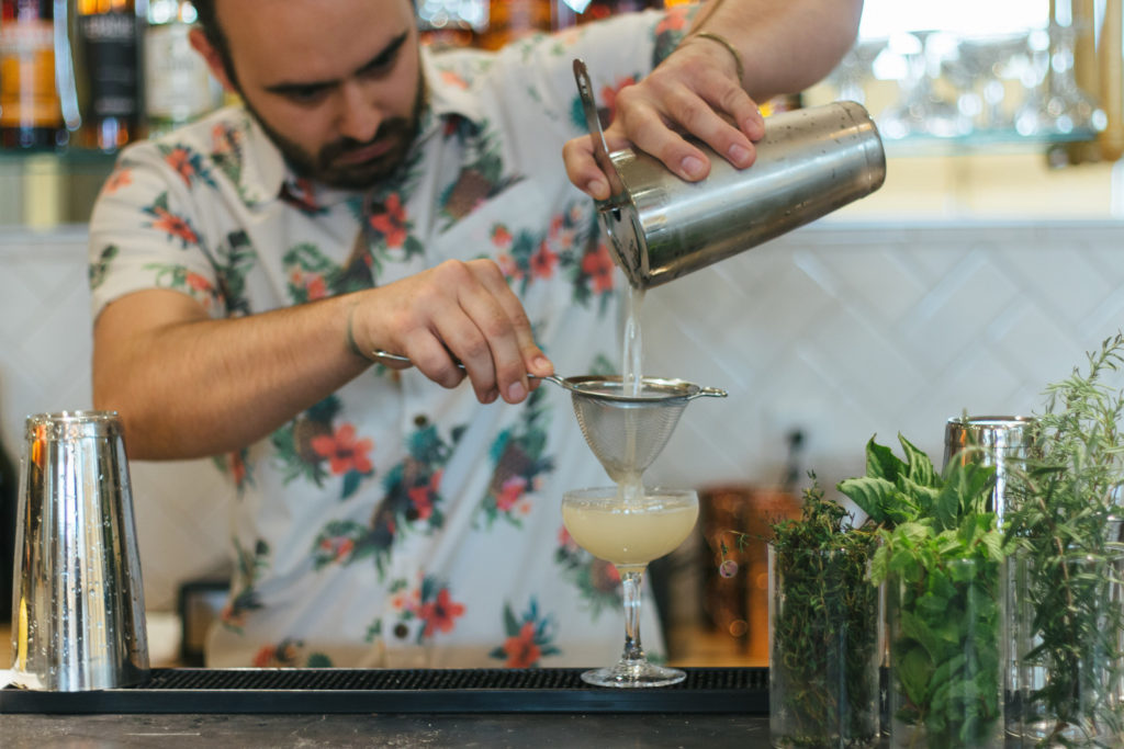 Bar director Lane Primeaux makes the Jolly Roger, a mix of mezcal, tequila, dry curacao, lemon, cucumber, jalapeño syrup and bitters.