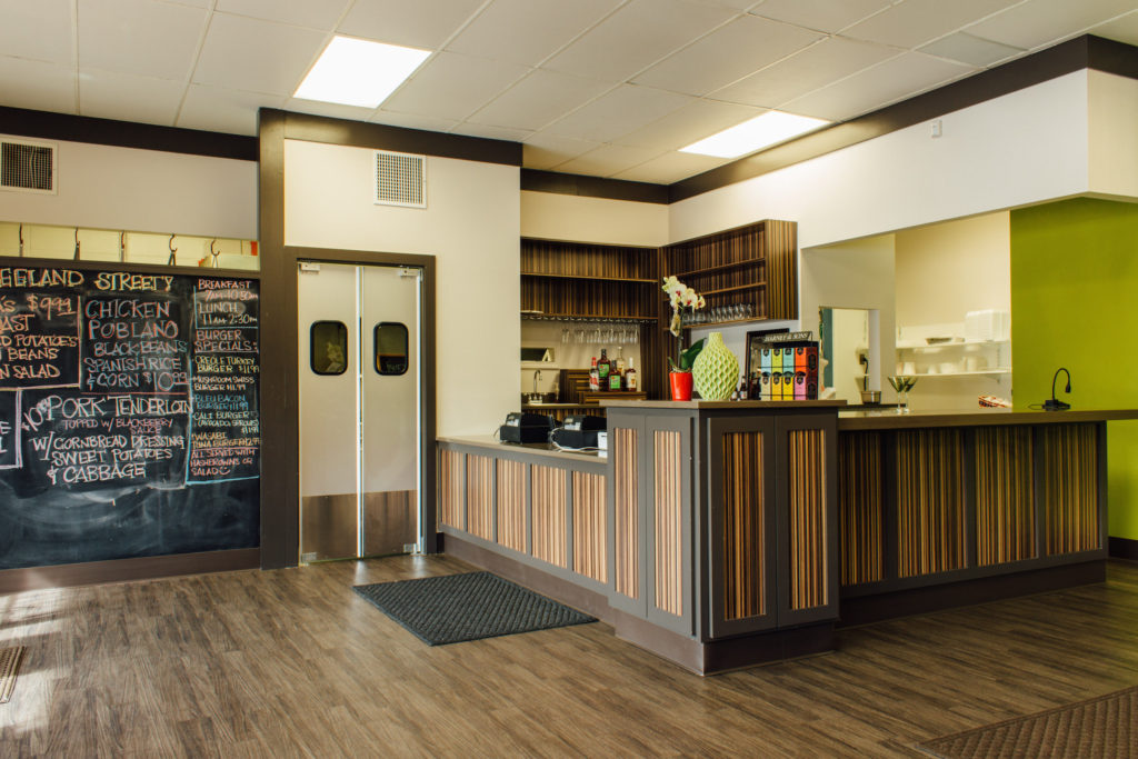 The Zeeland Street Market remodel features a beautiful counter, new flooring, and the familiar and fun chalkboard.