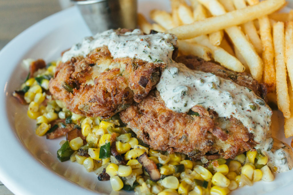 Crabcakes with ravigote sauce, corn maque choux and shoestring fries