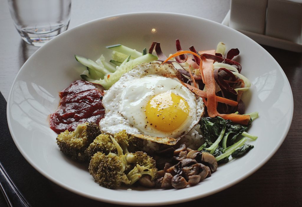 Cocha's bibimbap, with a fried egg, rice, vegetables and a savory gochujang sauce.