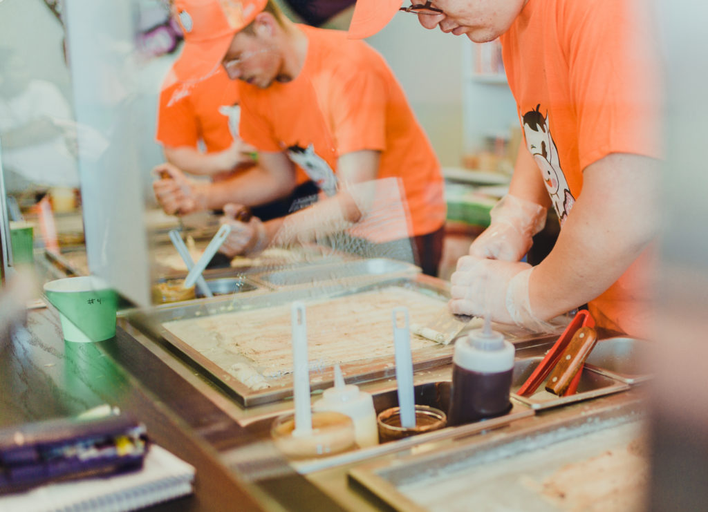 Freezing Cow workers rolling ice cream