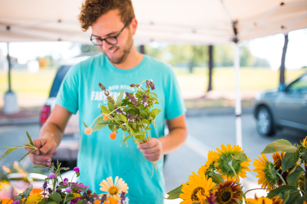 The newest flower vendor at the farmers market grows his stems within
