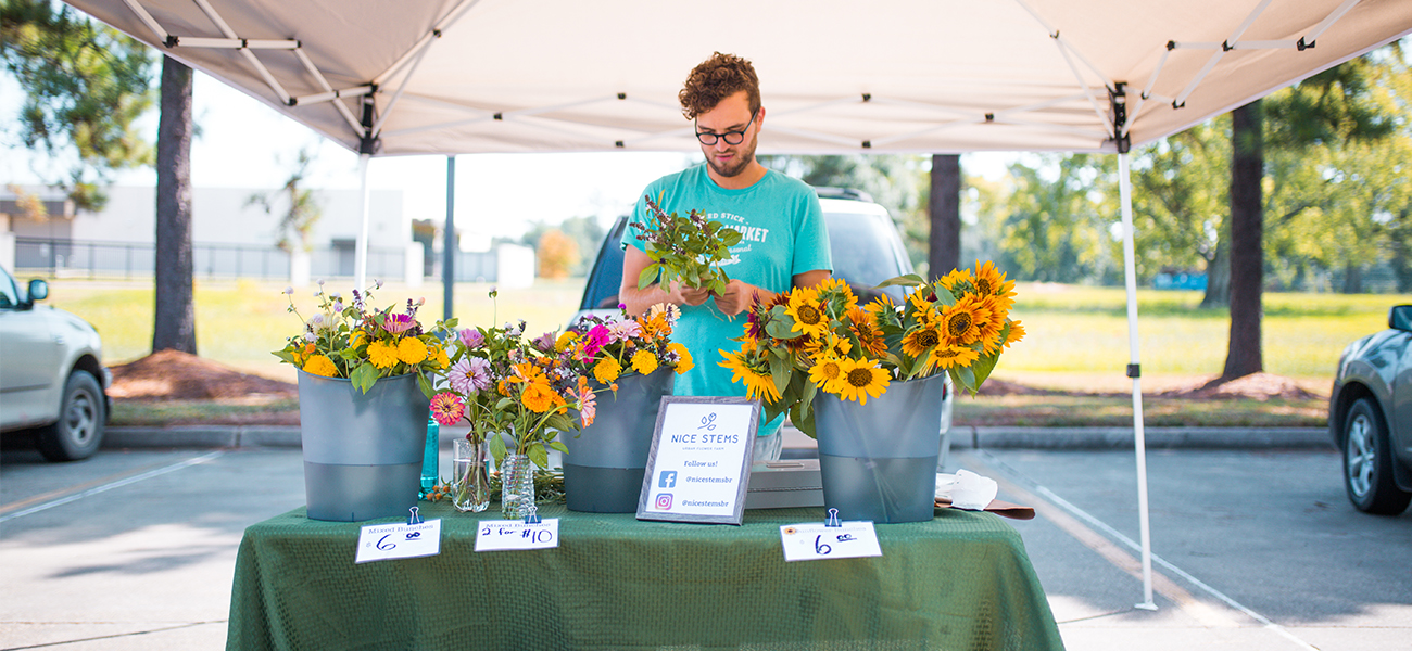 The newest flower vendor at the farmers market grows his stems within