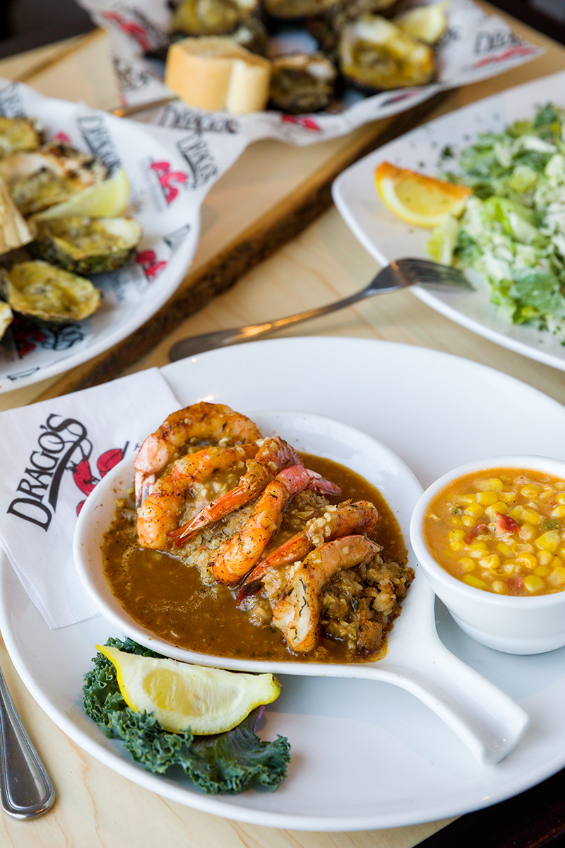 The Boudin Stuffed Shrimp entree serves the spicy crustaceans over boudin stuffing, all nestled in a peppery brown gravy.