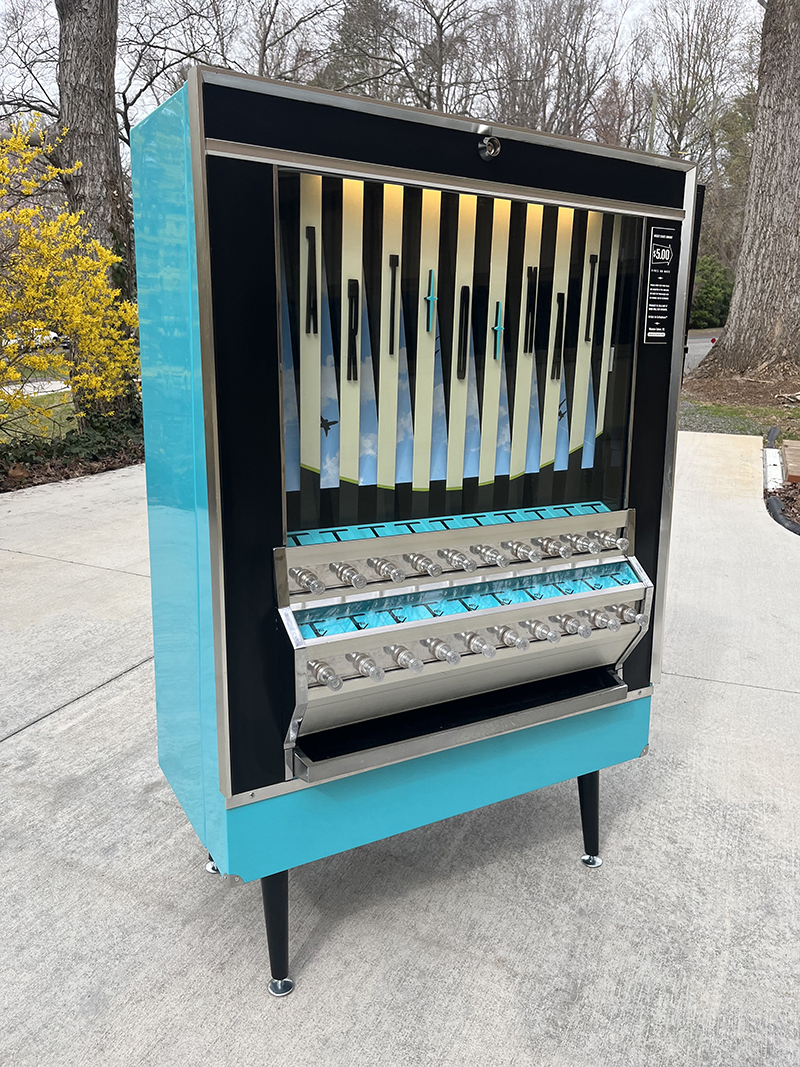 Land works of art before boarding a flight at BTR, courtesy the country's  first airport Art-o-Mat vending machine