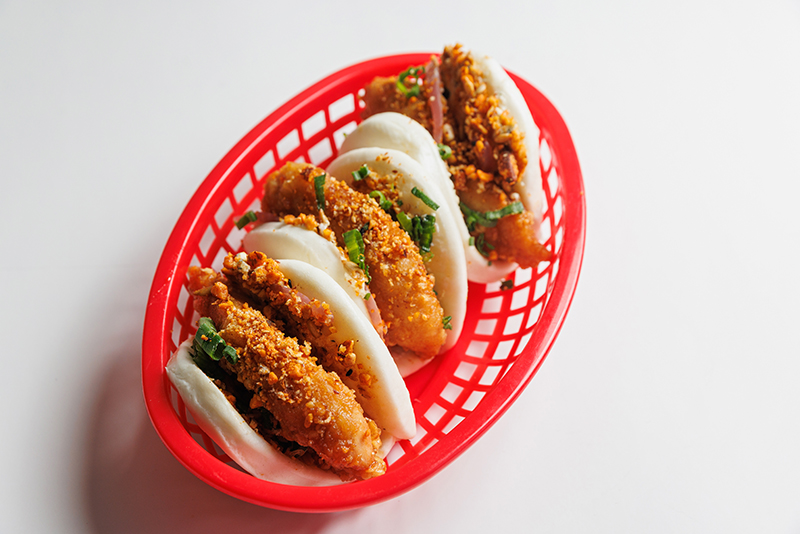 Three of Chow Yum’s Hot Honey Chicken Bao in a basket