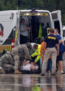 A rescue is made during unprecedented flooding in Louisiana. (THE ASSOCIATED PRESS)