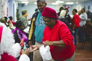 Nancy Washington receives a gift from Santa Claus
